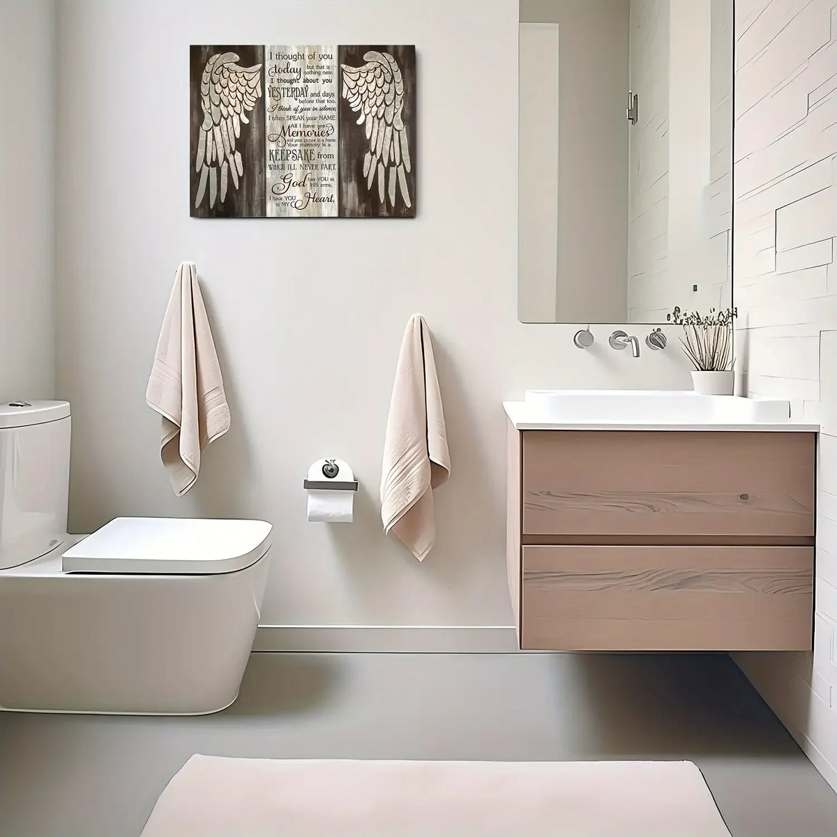 Farmhouse wing wooden frame wall art above a bathroom vanity and toilet.