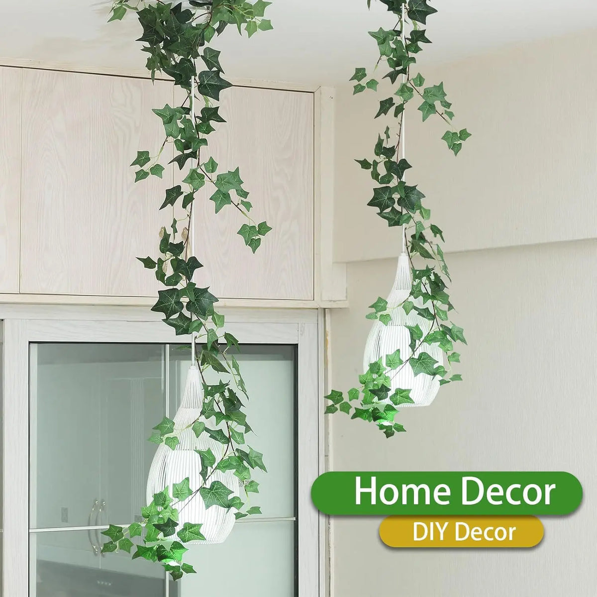 Artificial ivy garland hanging in front of a window for home decor