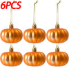 Six golden orange pumpkin hanging ornaments displayed against a white background.