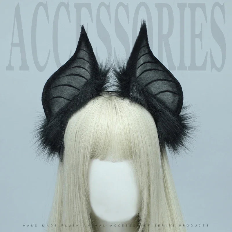 A pair of black bat simulation ears made of faux fur attached to a blonde wig display.