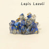 A cluster of blue and gray lapis lazuli crystals with gold inclusions.