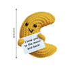 Handmade crochet potato doll in yellow with a white tag that reads I love you to the moon and back