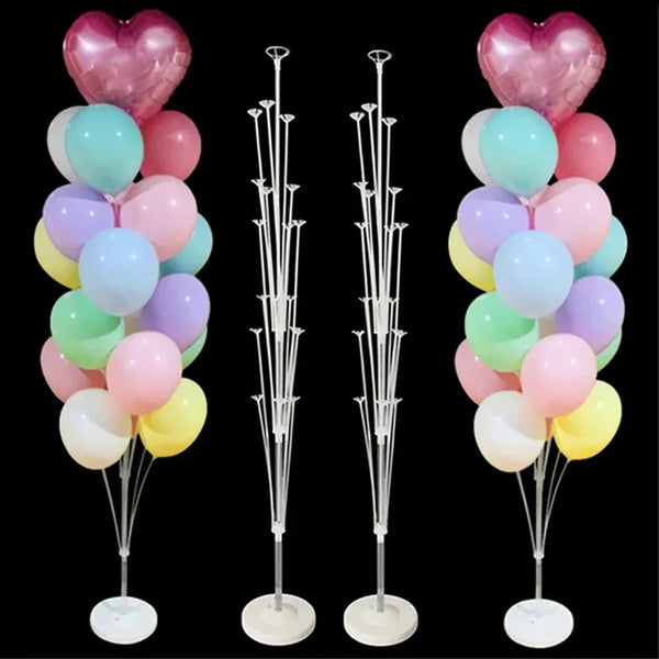 A set of pink and light blue balloons displayed on individual stands with bases and poles for party decorations
