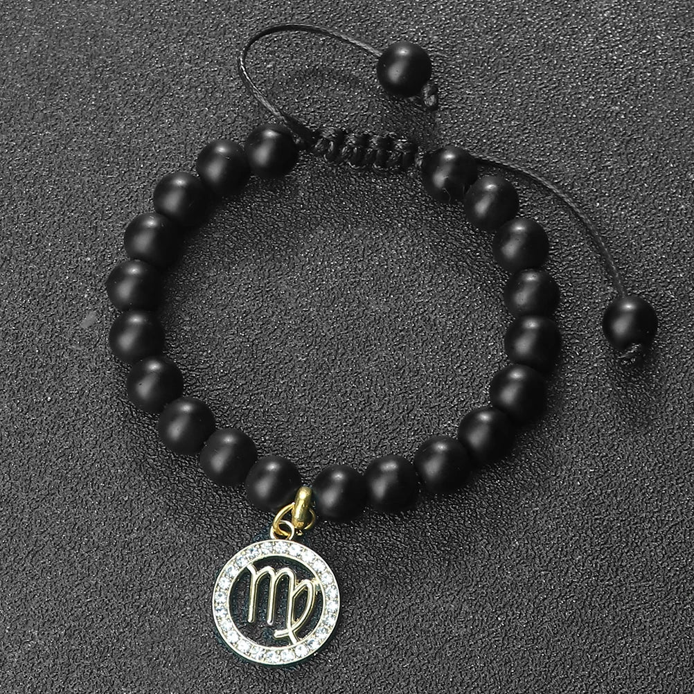A black beaded bracelet with a circular pendant featuring the zodiac symbol for Virgo.
