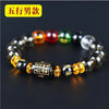 A bracelet made of five elements crystals featuring black, amber, red, green, and clear beads.