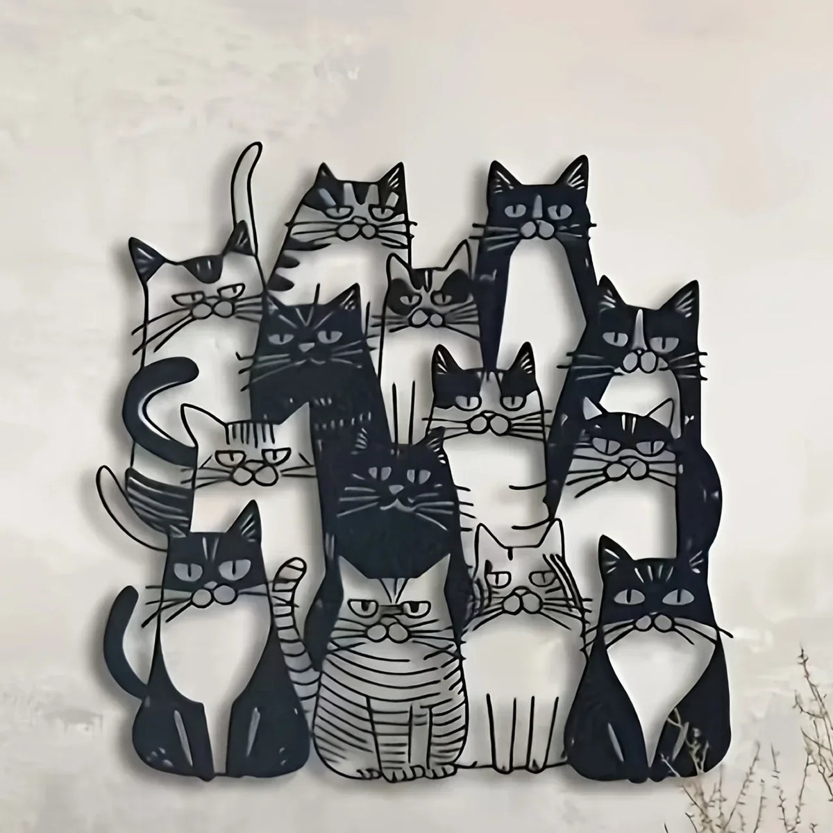 Black and gray silhouette cat wall art featuring various feline faces for home decor