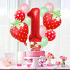 A red and pink strawberry foil balloon set featuring a large number one balloon and several round balloons.