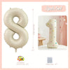 A set of three 32 inch Milky White aluminum foil number balloons, including a large number balloon and twenty glue dots.