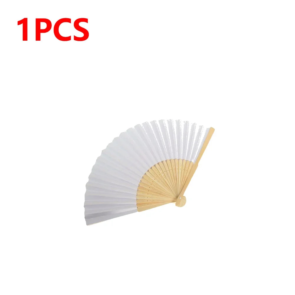 A white and natural bamboo folding hand fan with delicate pleats.