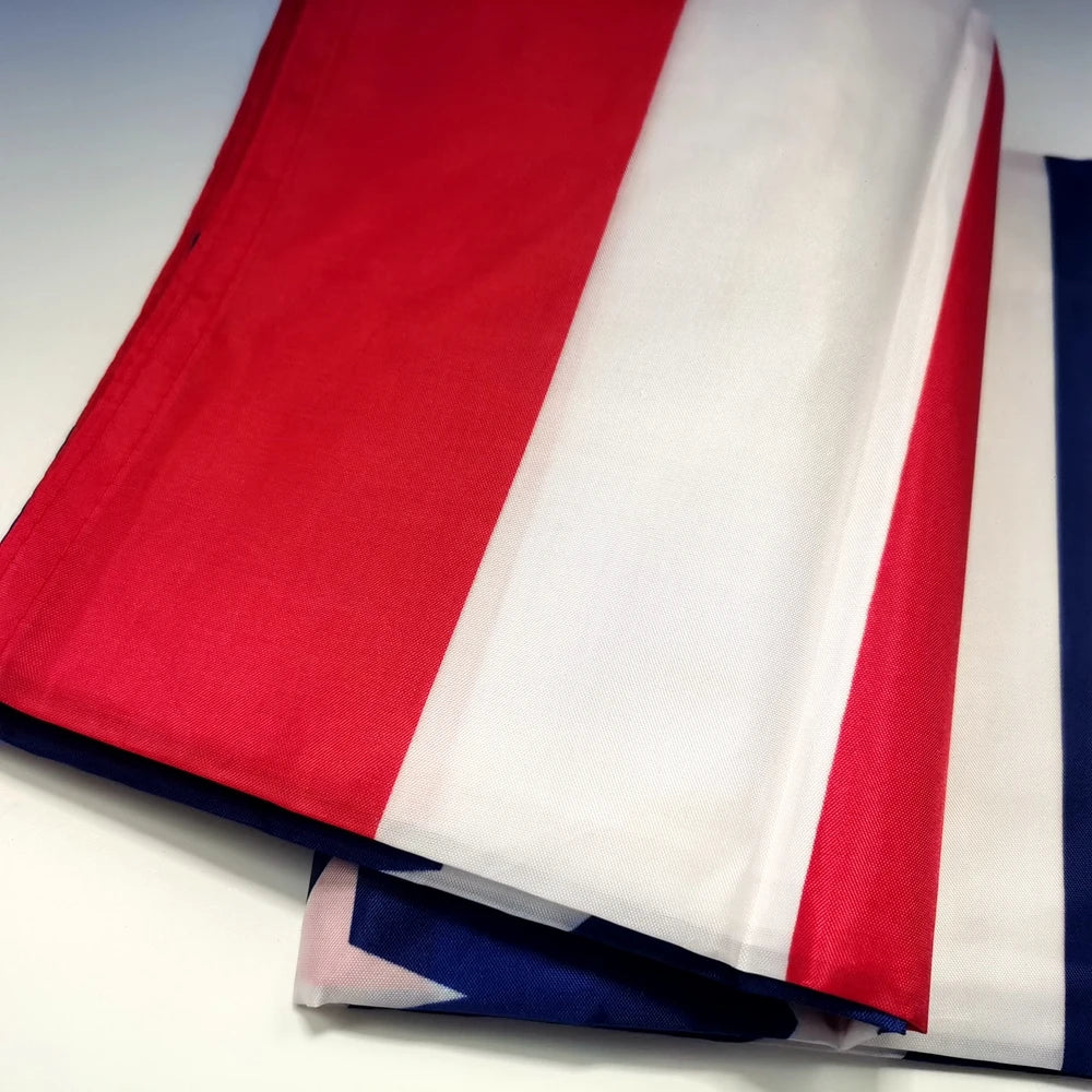 A decorative banner featuring vertical stripes of red, white, and blue fabric.