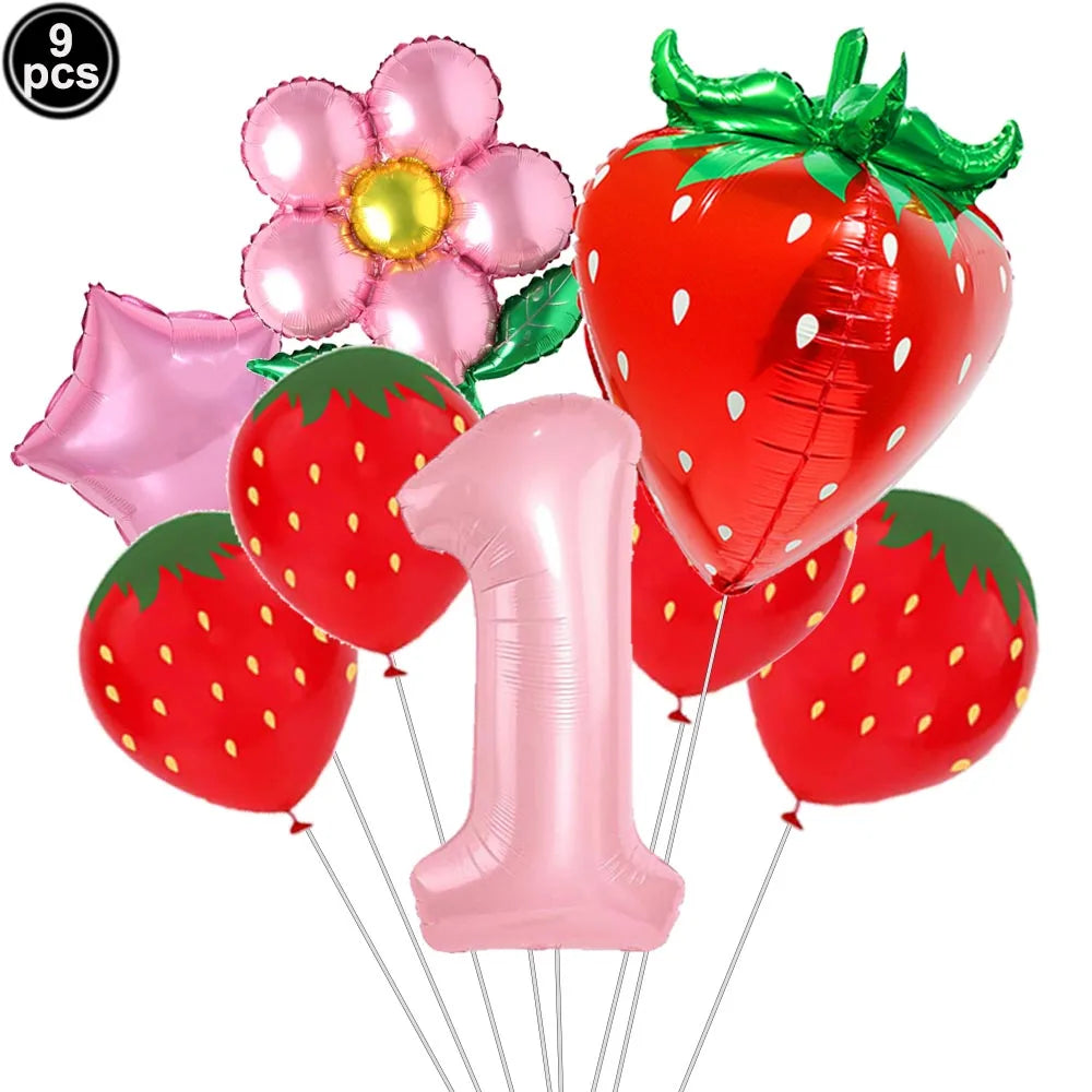 A set of nine pink and red strawberry balloons, including a number one balloon, for a party kit.