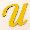 A yellow 3D acrylic letter U wall sticker against a light background.
