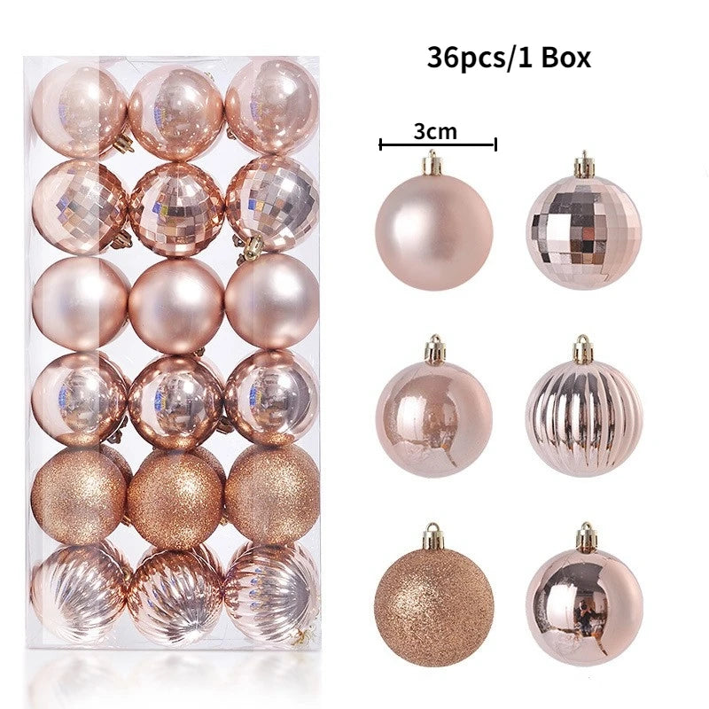 A box containing 36 festive Christmas tree ornament balls in various shades of rose gold and silver.