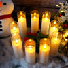 A set of five classic flameless LED candles in glass holders are arranged on a white surface.