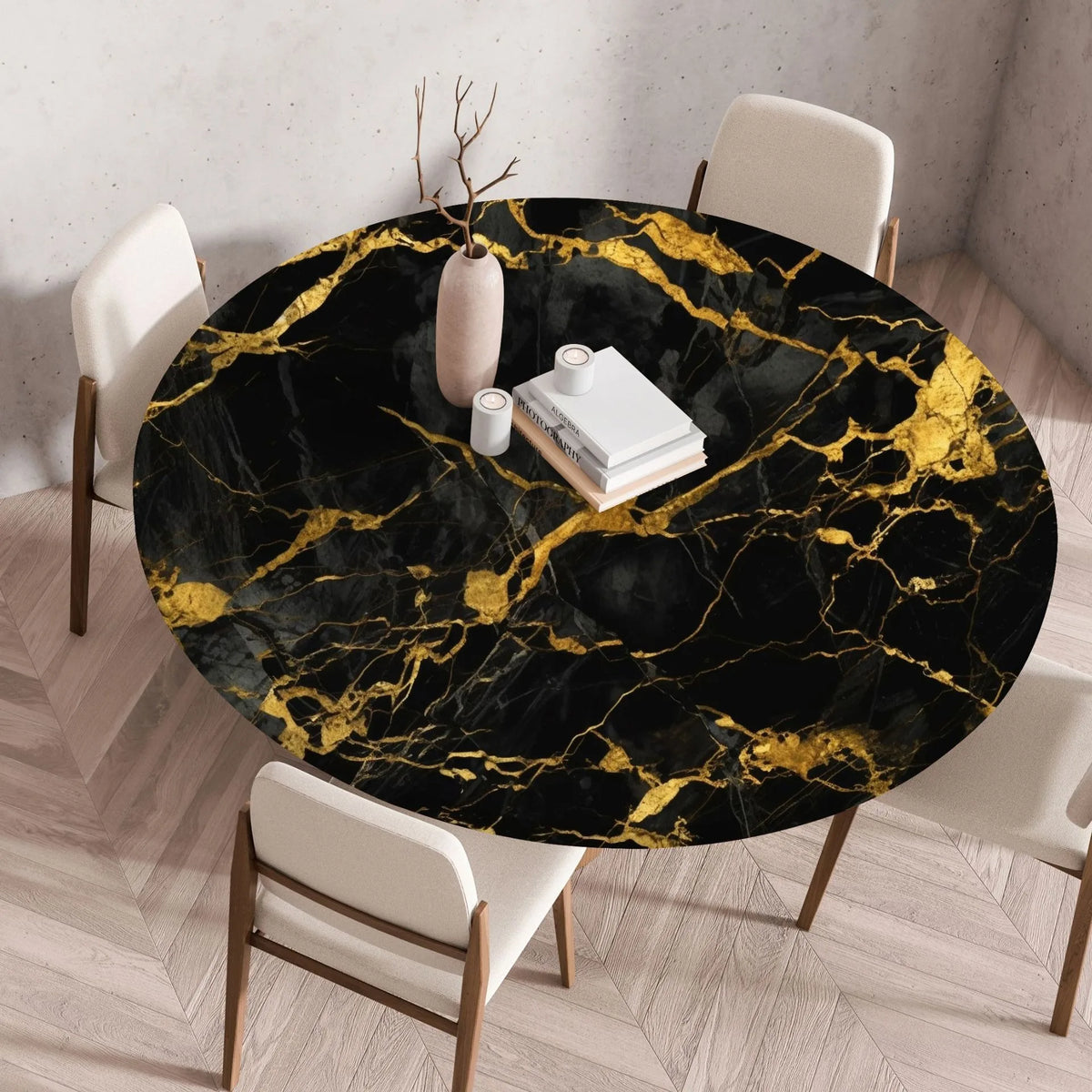 A round black marble print tablecloth with gold veining is displayed on a wooden table in a modern room.