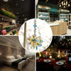 A sparkling crystal star suncatcher ornament hanging in a light, modern interior setting.