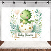 A watercolor illustration of a baby shower backdrop featuring a green dinosaur hatching from an egg surrounded by lush green 