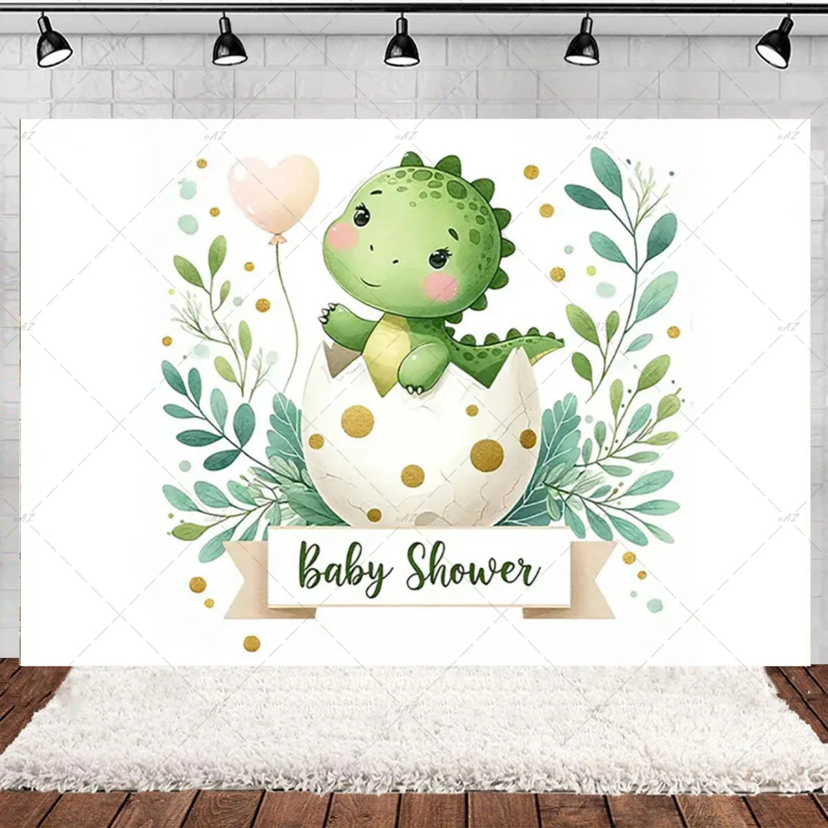 A watercolor illustration of a baby shower backdrop featuring a green dinosaur hatching from an egg surrounded by lush green 