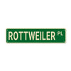 Green rectangular metal sign with white text reading ROTTWEILER PL