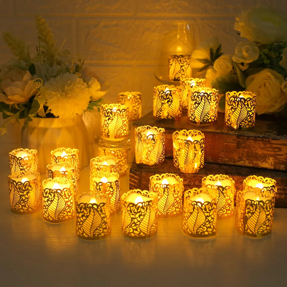 A collection of glowing yellow LED tea light candles in decorative paper lampshades arranged on a wooden surface.