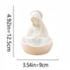 A white resin statue of the Virgin Mary with a draped veil, used for Catholic home decor.
