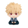 Chibi collectible figure of a spiky blonde character with intense red eyes and gray clothing.