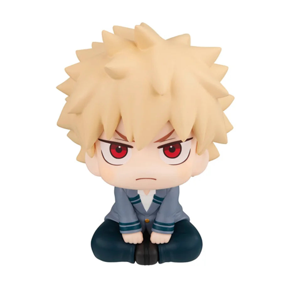 Chibi collectible figure of a spiky blonde character with intense red eyes and gray clothing.