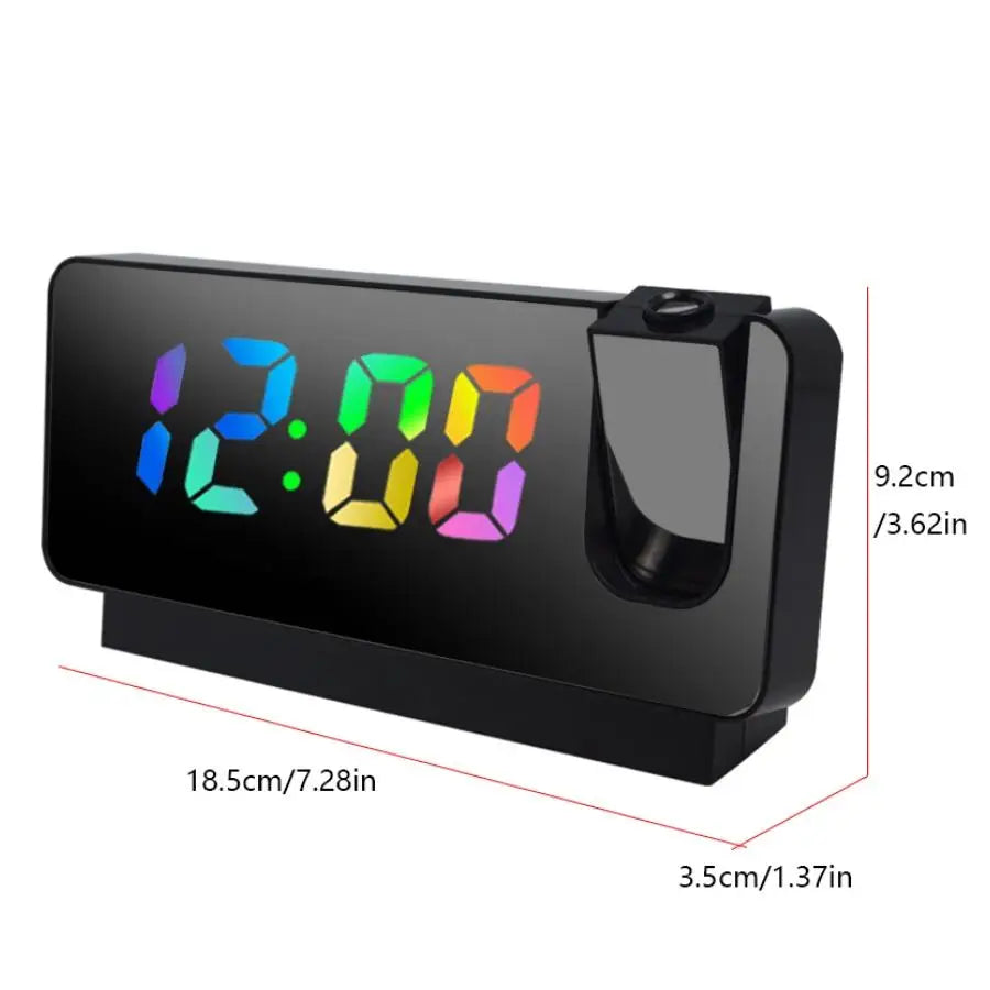 A black projection alarm clock with a large LED display showing 12:00 on a surface.