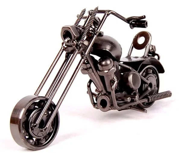 A handcrafted metal motorcycle model with a vintage diecast appearance, shown in a dark finish.