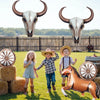 A foil horse number balloon set featuring a bull skull and a brown horse sculpture in a grassy field.