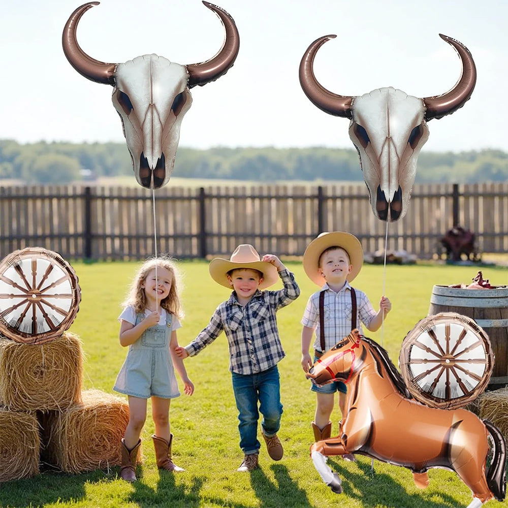 A foil horse number balloon set featuring a bull skull and a brown horse sculpture in a grassy field.