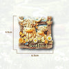 A wooden magnet featuring a 3D illustration of a shaggy Scottish Highland cow surrounded by flowers and the word Scotland.