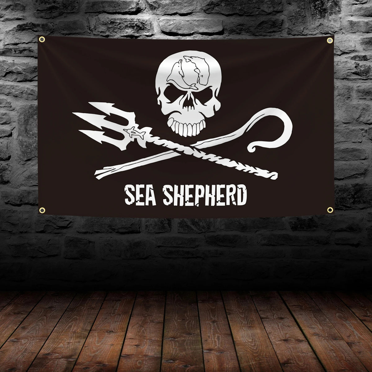 A black banner featuring a white skull and crossbones design with a pirate sword and the text SEA SHEPHERD.