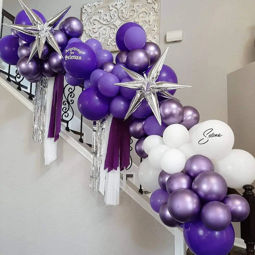 Purple and silver latex balloons shaped like stars and round balloons for party decor
