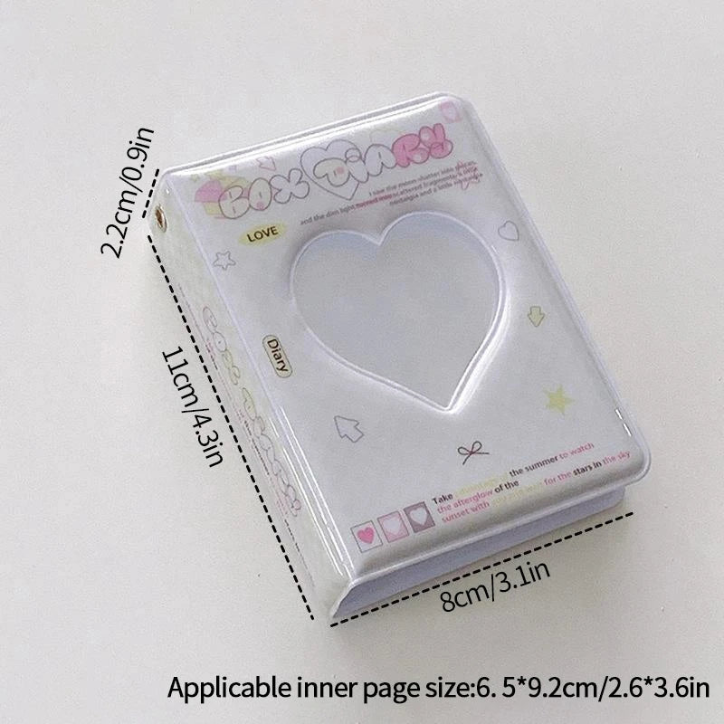 A clear plastic photo card album binder with a heart-shaped window and decorative text