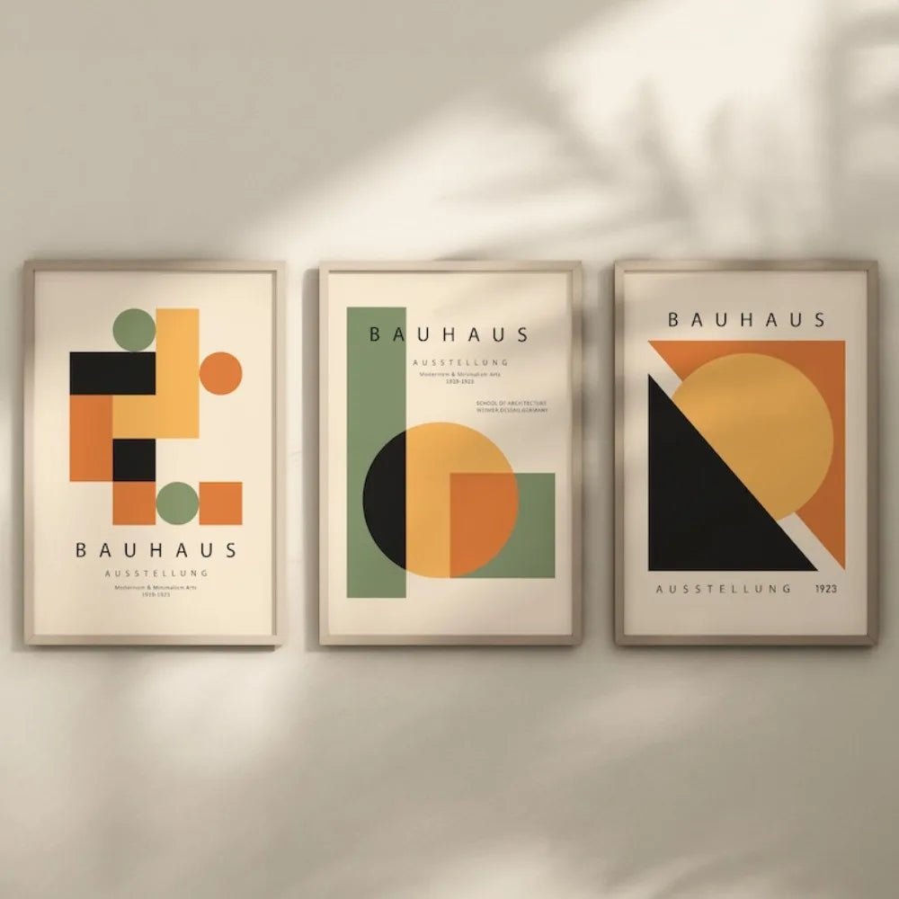Three abstract geometric canvas prints featuring muted earth tones and black on a light background.