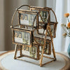 A brass rotating photo frame display featuring twelve small picture slots mounted on a metal stand.