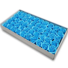 A rectangular box filled with numerous blue artificial rose flower heads.
