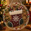 DIY Christmas pearl diamond painting stuncatcher featuring a festive red and green stocking hanging by a metal chain