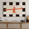 A framed wall art print featuring an orange silhouette of a figure saying I love you this much on a black and white checkered