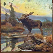Vintage Western Ammunition and Moose Metal Tin Sign featuring a silhouette of a moose.