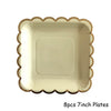 Eight 7-inch gold disposable party plates with scalloped edges