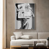 A black and white art print featuring a woman in a bikini, displayed on a canvas wall decor.