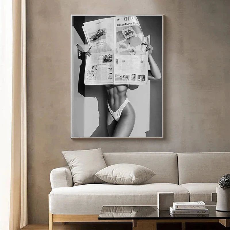 A black and white art print featuring a woman in a bikini, displayed on a canvas wall decor.