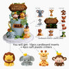 A tiered cake decorated with jungle animal toppers including elephants, lions, and monkeys.