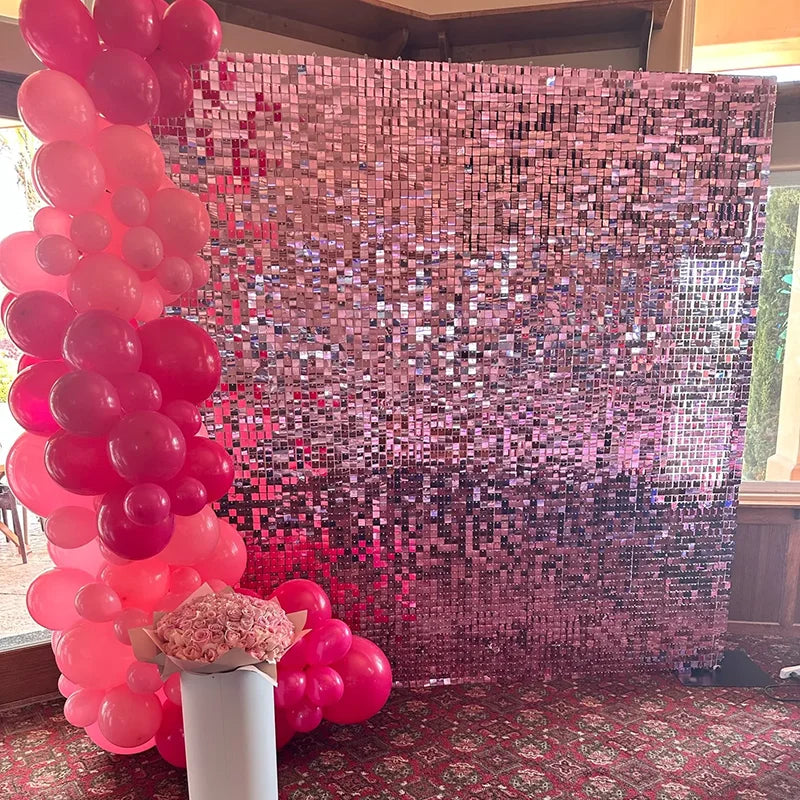 A sparkling backdrop made of iridescent pink and purple sequins for a celebration.