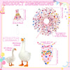 A set of decorative white goose ornaments and a pink birthday balloon