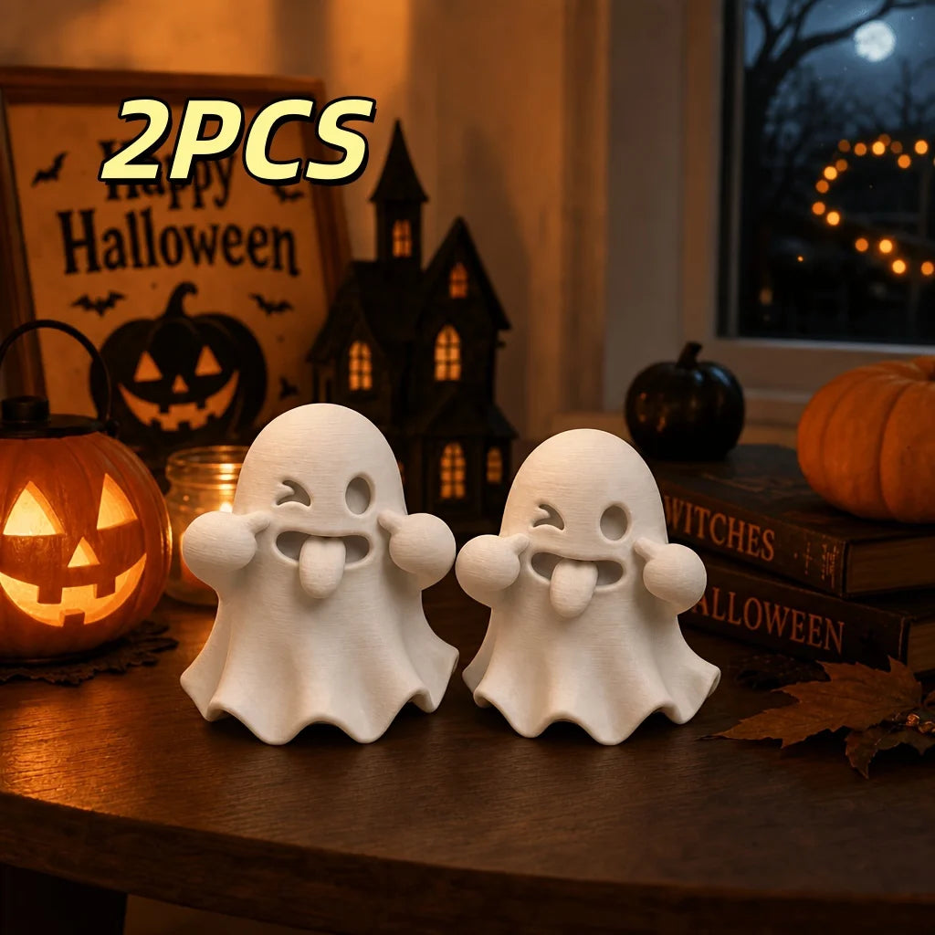 Two white kawaii ghost statues for Halloween decor displayed on a wooden surface.
