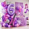 Purple music theme birthday party decorations featuring balloons and a guitar