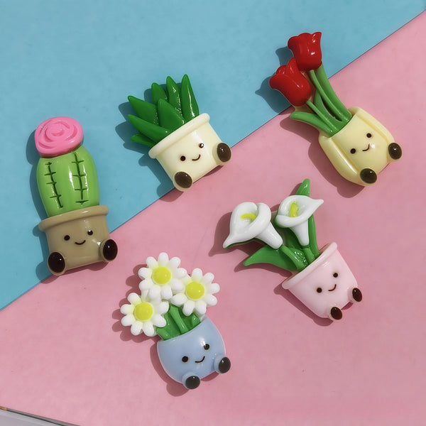 A set of kawaii potted plant fridge magnets featuring various green and pink succulent-like plants.